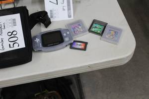 lot 508 image: Game Boy Advance Hand Gaming Console  with Game Cartridges - Bugs Bunny, Pro BMX 2, Tarzan, Donkey Kong