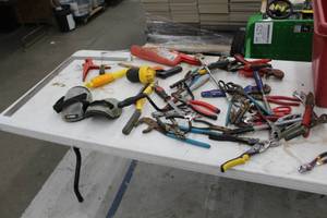 lot 524 image: Lot of Hand Tools (in bin)  - Slide Lock Pliers, Locking Pliers, Snips, Wire Cutters, Pliers, Knee Pads, Wire Brush, String Line, Crescent Wrench, Vise Grip and much more