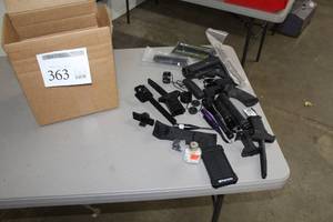 lot 363 image: Gun Parts, Misc  with Flashlights, Speedloader, Gun Handles, Springs, Charging Handle and much more