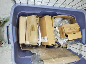 lot 46 image: Tote of Hardware including cabinet hinges and door hardware
