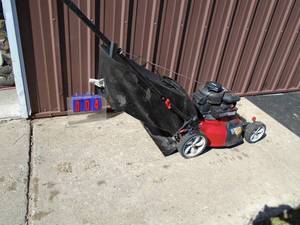 Used lawn mower with bag. Runs. As shown.