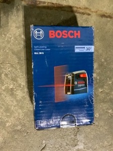 lot 24 image: Bosch 30 ft. Cross Line Laser Level Self Leveling with 360 Degree Flexible Mounting Device and Carrying Pouch. See Pictures