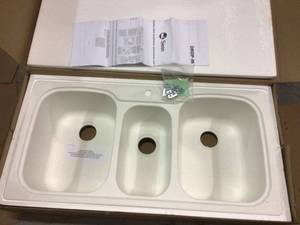 lot 47 image: Swan Drop-InUndermount Solid Surface 44 in. 1-Hole 402040 Triple Bowl Kitchen Sink in White &nbspCustomer Returns See Pictures