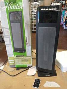 lot 39 image: HUNTER 24 in. 1500-Watt Digital Ceramic Tower Heater with Remote Control