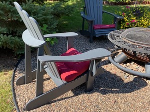 Wonderful Outdoor Grouping including a Firepit and Four Adirondack Chairs