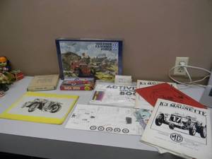 lot 24 image: AWESOME VINTAGE MG COLLECTION - COLORING BOOKS - PUZZLES - MODEL CARS - SEE PICTURES