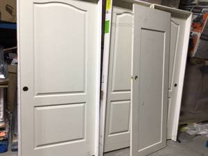 36 in. x 80 in. 2-Panel Arch Top Solid Core Textured Primed Composite Single Prehung Interior Door by Masonite Customer Returns See Pictures