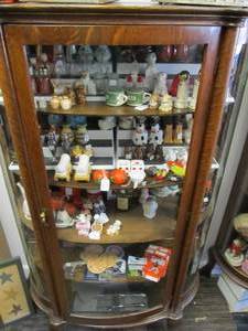 lot 15 image: Entire Contents of Cabinet - Many Salt & Pepper Shakers