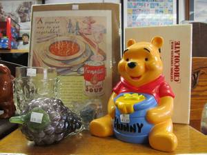 lot 118 image: Contents on top shelf- Winnie The Pooh Bank, Tiki Glass Mug, etc.