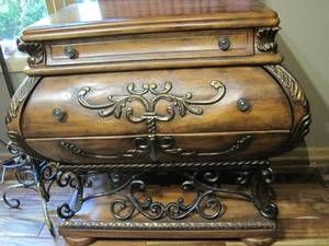 lot 2 image: Small curved front chest with ironwork base  feet.. 