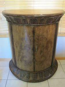 lot 22 image: Half Moon shaped Cupboard.