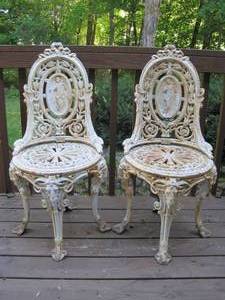 lot 24 image: Pair of Heavyweight Cast Iron Cameo Back Chairs . 