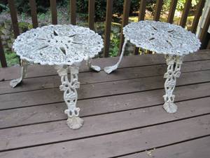 lot 27 image: A pair of iron cast tables from an 18th century antique design. 