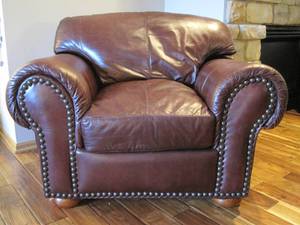 lot 43 image: Leather Armchair with brass tacksnailhead trim. 