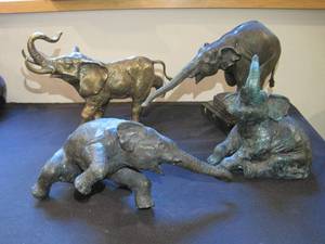 lot 78 image: 4 Heavy Elephants, lol 3 brass and 1 iron. 