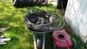 lot 30 image: Wheelbarrow Full Of Wire & An Outside Casing For A 22 Murray Lawnmower