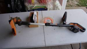 lot 123 image: WORX Weed Trimmer With Accessories---Extra Battery & Chargers--32 VMAX Lithium