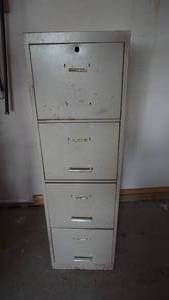 lot 181 image: An Antique Four Drawer File Cabinet W Extension Cords-A Garage Hanging Light & Miscellaneous Other Contents