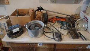 lot 240 image: Counter Full Of Surge Protectors-Extension Cords-Grabber-A.O. Smith AC Motor (S#316P758)-(Motor Must Be Grounded)-Hinges-Chain-Stitching Wire