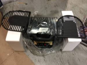 RoadTrip 285 Black SU Grill by Coleman Customer Returns See Pictures