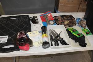 lot 1106 image: Camping and Fishing Accessories  with Trolling Prop, Water Camera Cable, Fish Knives, Fuel Sticks, Rod Holder, Fish Scales, WalleyeBag,  and more