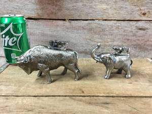 lot 27 image: Vintage Bison & Elephant Table Lighters