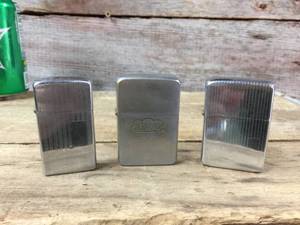 lot 28 image: 3 Vintage Zippo Pocket Lighters