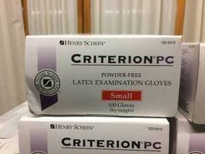 lot 36 image: Criterion LP Powdered (1 box) and Criterion PC Powder-Free Latex Examination Gloves (6 boxes)