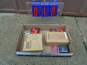 Flat of new laser measuring tool & laser tape measure. New condition. As shown.
