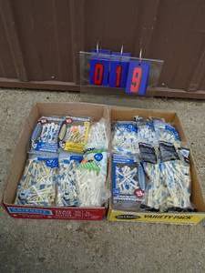 Qty of 2 flats of golf tees. New in box. As shown.