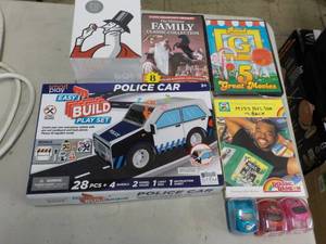lot 26 image: DVDs, unopened and Games...