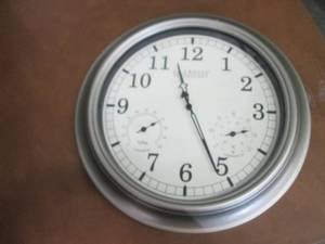lot 98 image: Wall Clock- side damage...