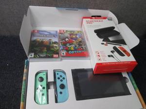 lot 127 image: Nintendo Switch Console Bundle with...