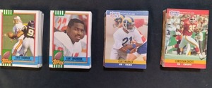 lot 19 image: 1990 Topps and 1990 Pro Set Footbal...