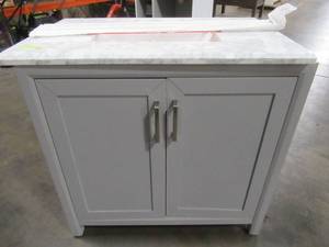 lot 223 image: Home Decorators Collection Rockleigh 36 in. W x 22 in. D Bath Vanity in Pebble Grey with Marble Vanity Top in Carrara White with White Basin - Cracked Top.