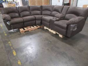 lot 151 image: Signature By Ashley Tambo 2-Piece Reclining Sectional In Canyon - LH RECLINER HAS ISSUES RECLINING AND POPPING THE FOOT REST WITH OUT ASSISTANCE.