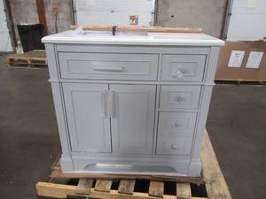 lot 257 image: Allen  Roth 36-in Light Gray Undermount Single Sink Bathroom Vanity with Natural Carrara Marble Top - Top CrackedChipped - Backboard of vanity damaged.
