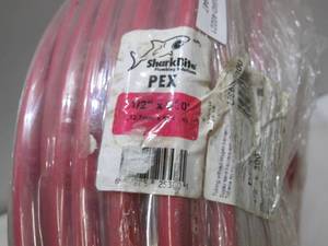 lot 947 image: Sharkbite 12 In. X 300 Ft. Red Pex Pipe Type B Coil
