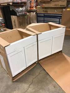 lot 22 image: Lot of 2 Courtland Shaker Assembled 30 in. x 34.5 in. x 24 in. Stock Sink Base Kitchen Cabinet in Polar White Finish by Hampton Bay Customer Returns See Pictures
