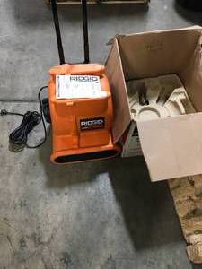 lot 42 image: 1625 CFM Blower Fan Air Mover with Handle and Wheels by RIDGID Customer Returns See Pictures