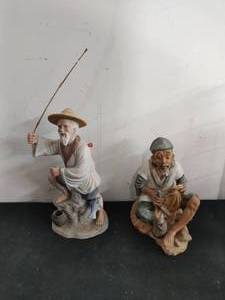 Two Fisherman Statues