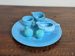 lot 27 image: Beautiful Blue Vintage Fiestaware and More Collection-14 Fiestaware Platter (Slight Crack) Gravy Boat 3 x 7 Fiestaware Creamer 3  Teacup (slight chip) 2.75 Salt & Pepper Shakers