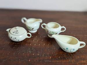 lot 30 image: Lovely 4 Piece Vintage Floral Porcelain Collection-Gravy Boat 3.5 x 7 Sugar Bowl  3 x 5 Creamer 3.5 x 5.5 Creamer with Cover 3 x 5
