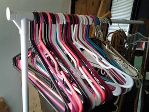 lot 39 image: Plastic Clothing Storage Rack with Hangers and Rope