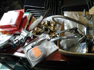 lot 124 image: Window Insulation Kits, (2) Faucets and Shower Heads, Doorknob Parts, Etc. 
