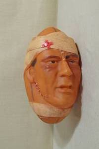 lot 132 image: Antique Football Toy - Beat Up Face