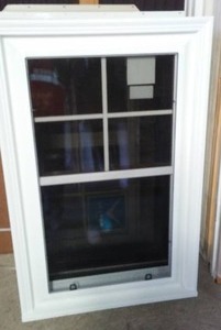 lot 24 image: Window Hayfield Single Hung Vinyl Window, Wood Laminate Interior. 27.5 x 44.75. Includes Vinyl Brick Mold, No Nailing Fins.
