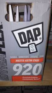 lot 100 image: Case Of 12 DAP Dyna Flex 920 Caulk Brown and White