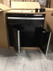lot 13 image: Ready-to-Assemble 24-Gauge Steel 1-Drawer 2-Door Garage Base Cabinet in Black (28 in. W x 33 in. H x 18 in. D) by Husky Customer Returns See Pictures