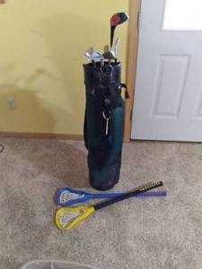 lot 25 image: Fore Set of Wilson Golf Clubs, Bag, and LaCrosse Rackets
